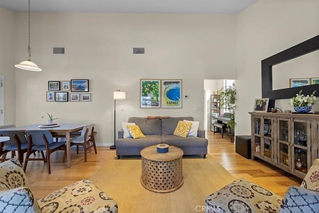243 Park Ave, Long Beach, CA 90803 - living room with wood finished floors and a towering ceiling