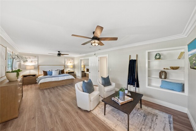 bedroom featuring crown molding, ceiling fan, and light hardwood / wood-style floors