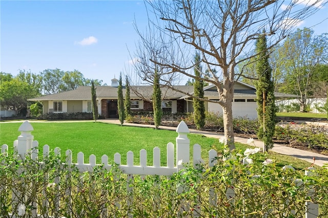 ranch-style home with a front lawn