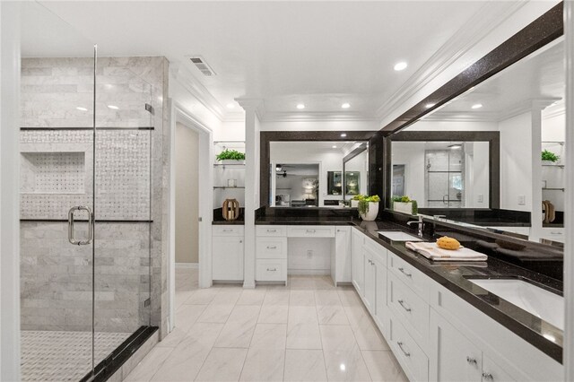 bathroom featuring an enclosed shower, vanity, and crown molding