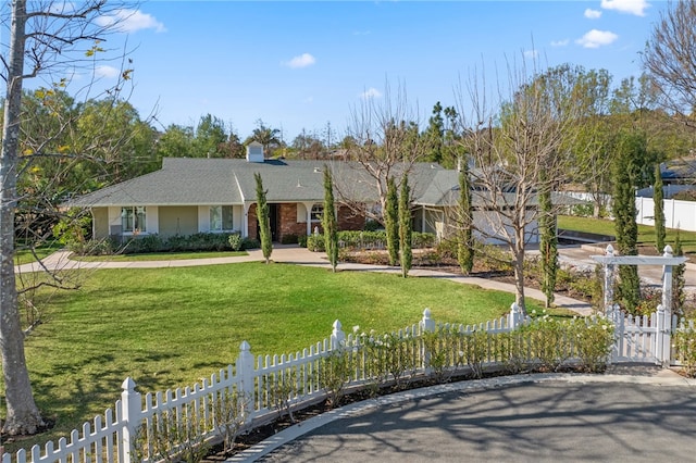 view of front of property with a front lawn