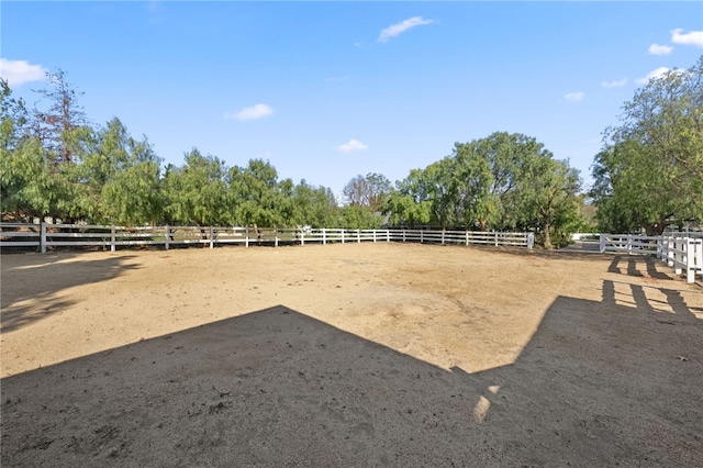 view of yard with a rural view