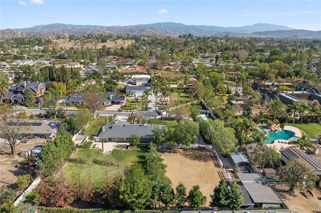 birds eye view of property with a mountain view