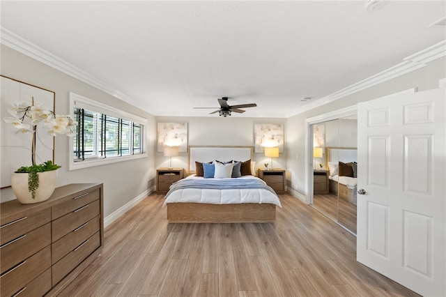 bedroom featuring crown molding and light hardwood / wood-style floors