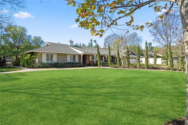 ranch-style house with a front yard