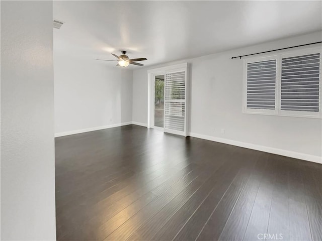 unfurnished room featuring ceiling fan and dark hardwood / wood-style floors