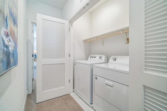 laundry room featuring washing machine and dryer