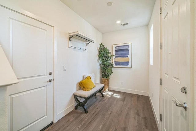 doorway with dark hardwood / wood-style floors