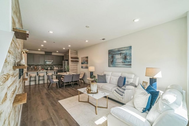 living room featuring dark hardwood / wood-style flooring