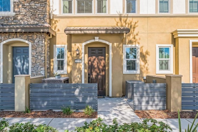 property entrance featuring central air condition unit