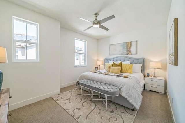 bedroom featuring light carpet and ceiling fan