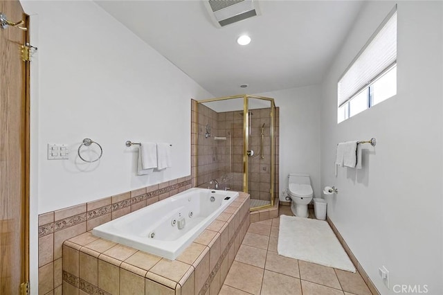 bathroom featuring tile patterned flooring, toilet, and separate shower and tub