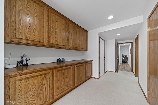 interior space featuring light colored carpet