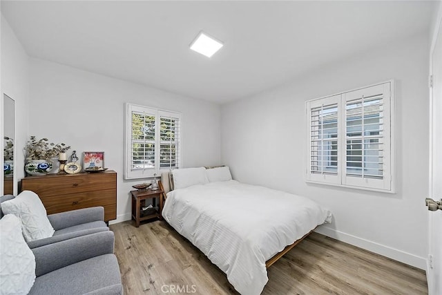 bedroom featuring light wood-type flooring