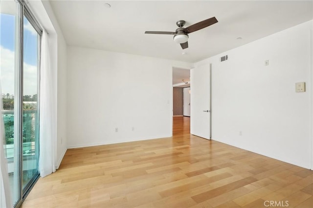 unfurnished room featuring ceiling fan and light hardwood / wood-style floors