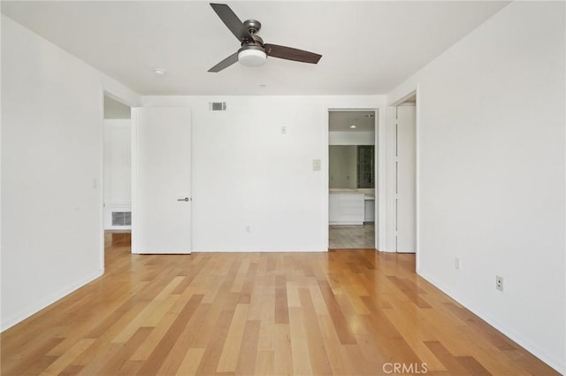 unfurnished room featuring ceiling fan and hardwood / wood-style floors