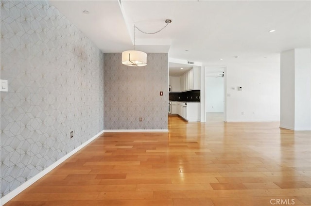 unfurnished room featuring light hardwood / wood-style flooring