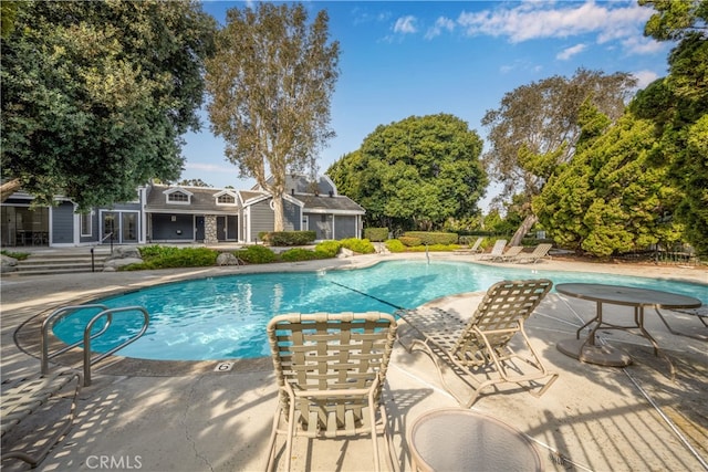 pool with a patio area