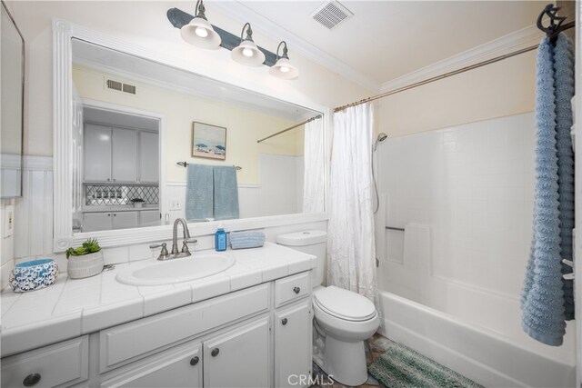 full bathroom featuring ornamental molding, toilet, shower / tub combo, and vanity