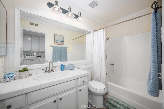 bathroom with toilet, visible vents, crown molding, and vanity