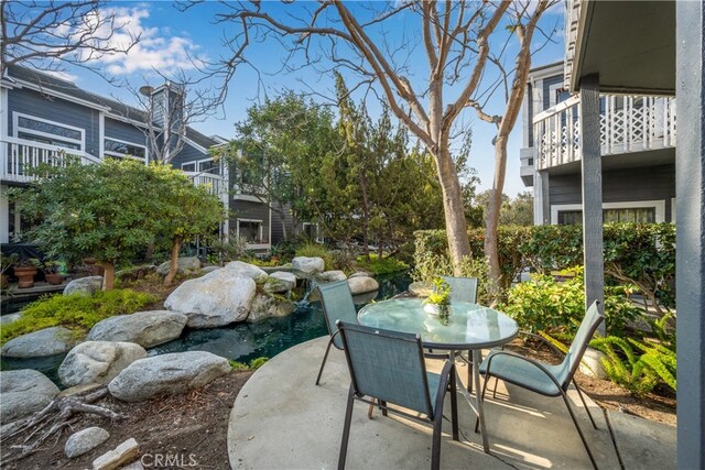 view of patio / terrace with a balcony