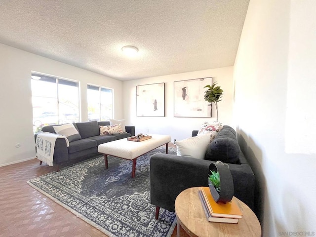 living room featuring a textured ceiling