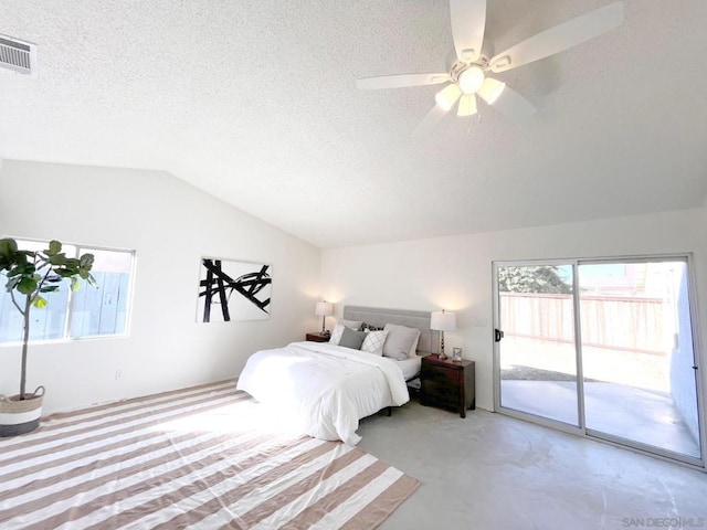 bedroom featuring ceiling fan, access to exterior, vaulted ceiling, and a textured ceiling