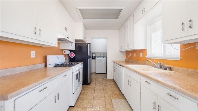 kitchen featuring washer / clothes dryer, sink, white cabinets, light tile patterned floors, and white appliances