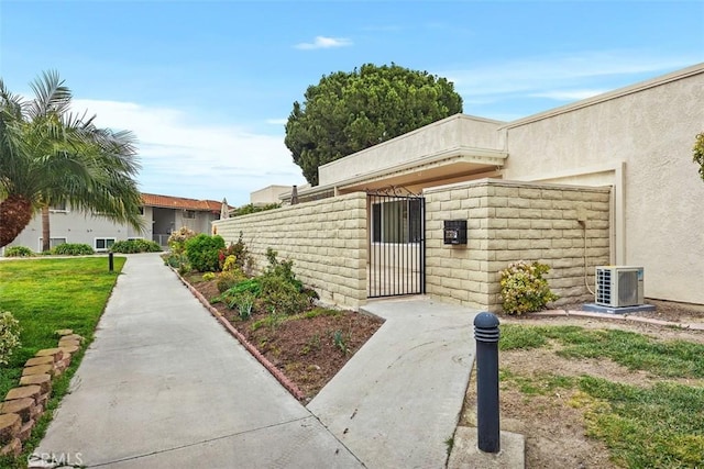 entrance to property featuring central AC unit