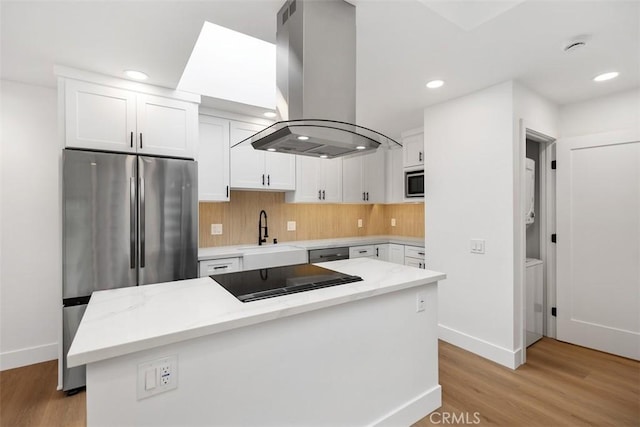 kitchen featuring a center island, white cabinets, and island exhaust hood