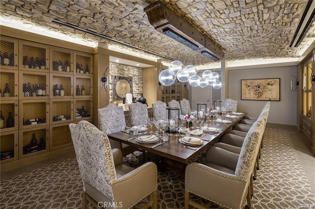 dining space with brick ceiling