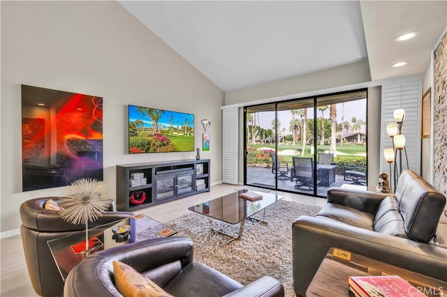 living room with high vaulted ceiling