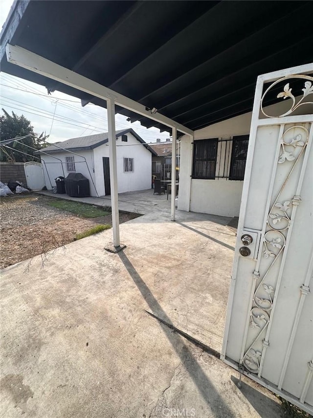 view of patio featuring fence