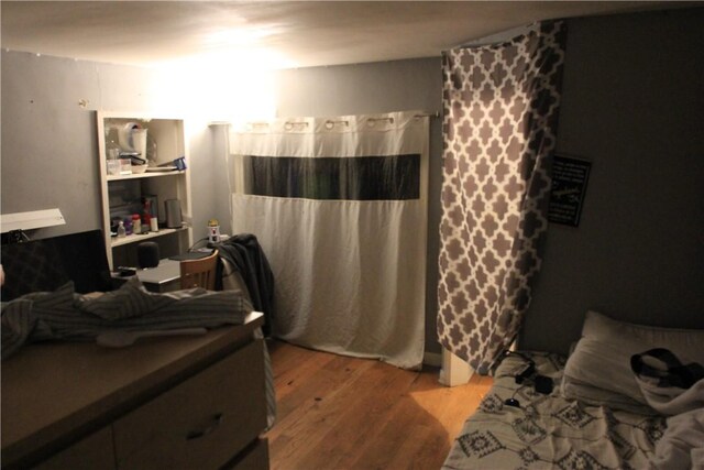 bedroom with wood finished floors