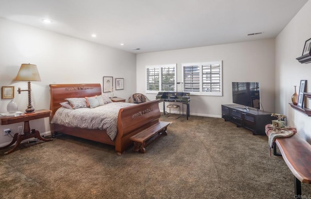 bedroom featuring dark colored carpet