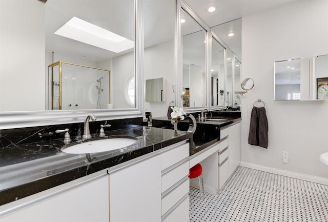 7487 Via De Fortuna, Carlsbad, CA 92009 - full bath featuring a skylight, tile patterned floors, a stall shower, double vanity, and baseboards