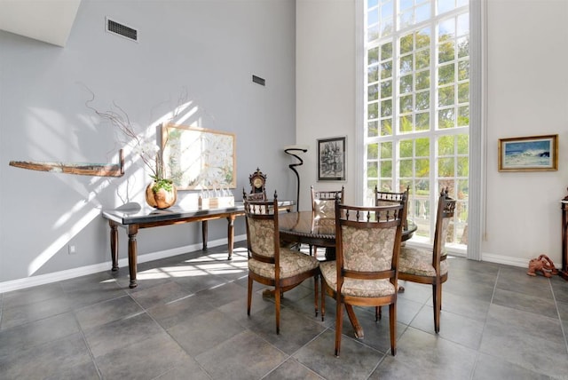 7487 Via De Fortuna, Carlsbad, CA 92009 - dining space featuring a high ceiling and baseboards