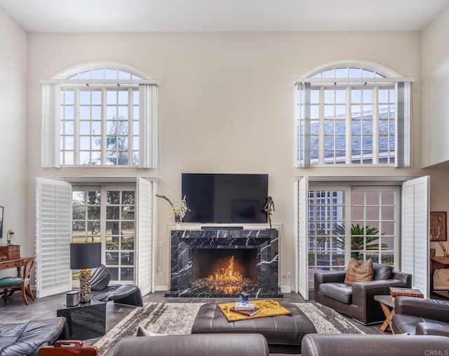 7487 Via De Fortuna, Carlsbad, CA 92009 - living room with a high ceiling, plenty of natural light, and a fireplace