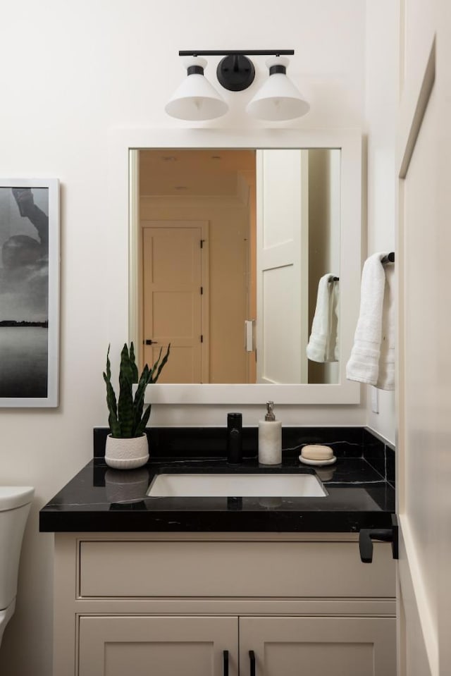 bathroom with vanity and toilet