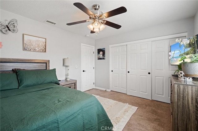 bedroom with carpet, ceiling fan, and a closet