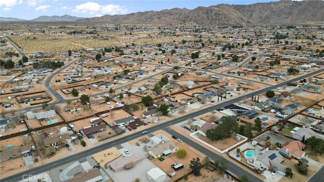 drone / aerial view featuring a mountain view