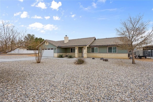 ranch-style home featuring a garage