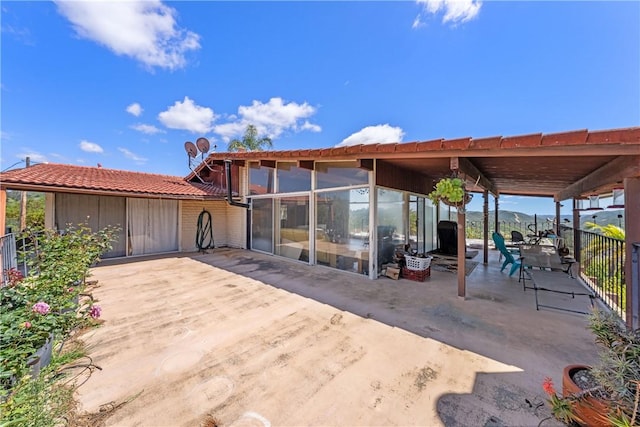 back of house with a patio