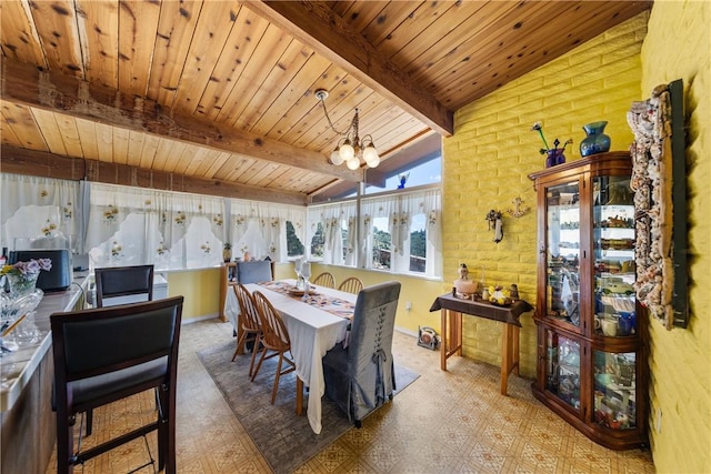 dining space featuring an inviting chandelier, vaulted ceiling with beams, and wooden ceiling