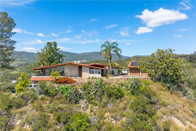 rear view of property with a mountain view