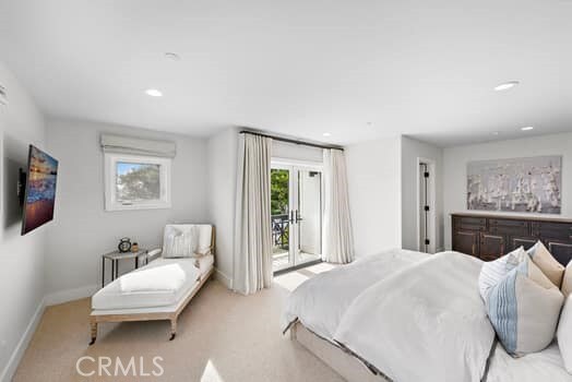 carpeted bedroom featuring access to outside