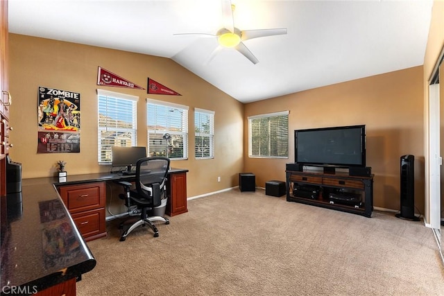 carpeted office featuring vaulted ceiling and ceiling fan