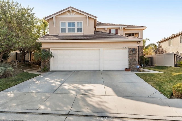 view of front property featuring a garage and a front yard