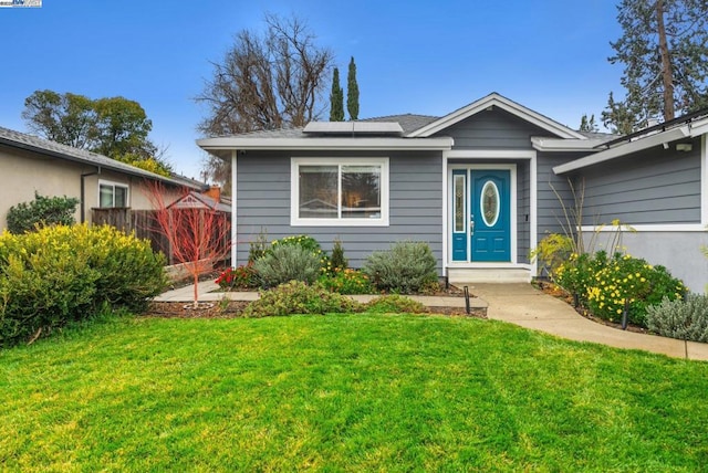 bungalow-style house with a front yard