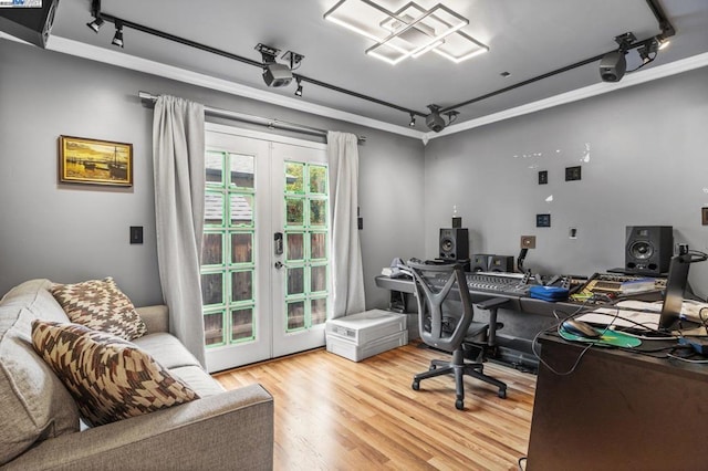 office area featuring crown molding, hardwood / wood-style flooring, track lighting, and french doors